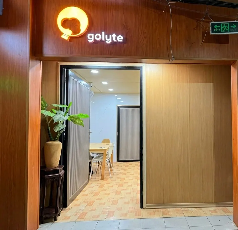 The entrance at building 47 with the lit golyte sign